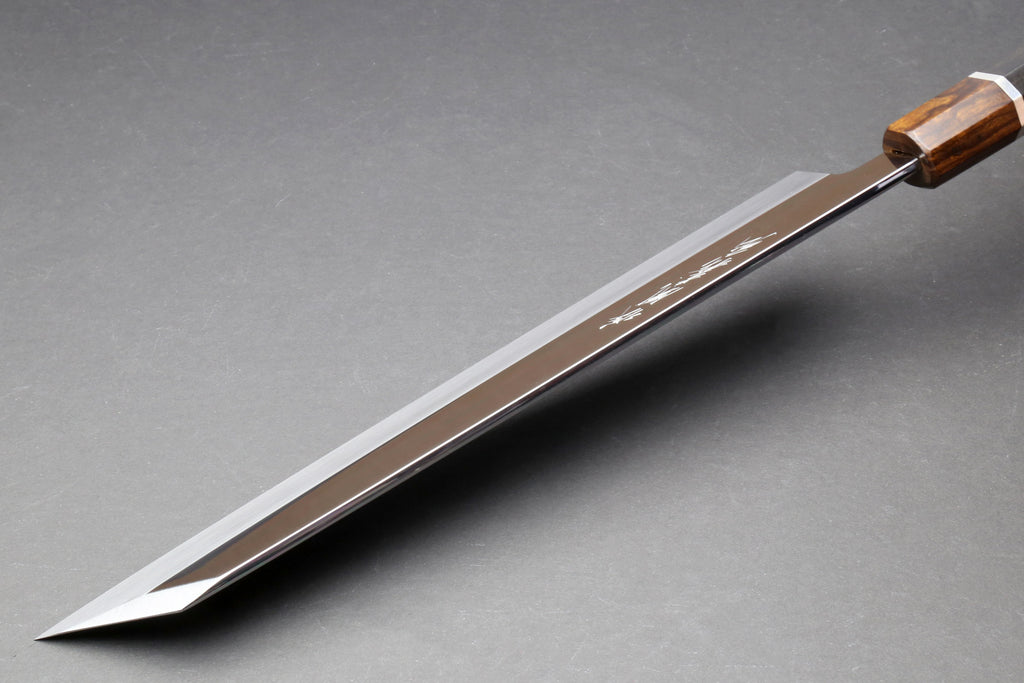 Kiritsuke knife with mirror-finished blade and warm brown handle with silver ring
