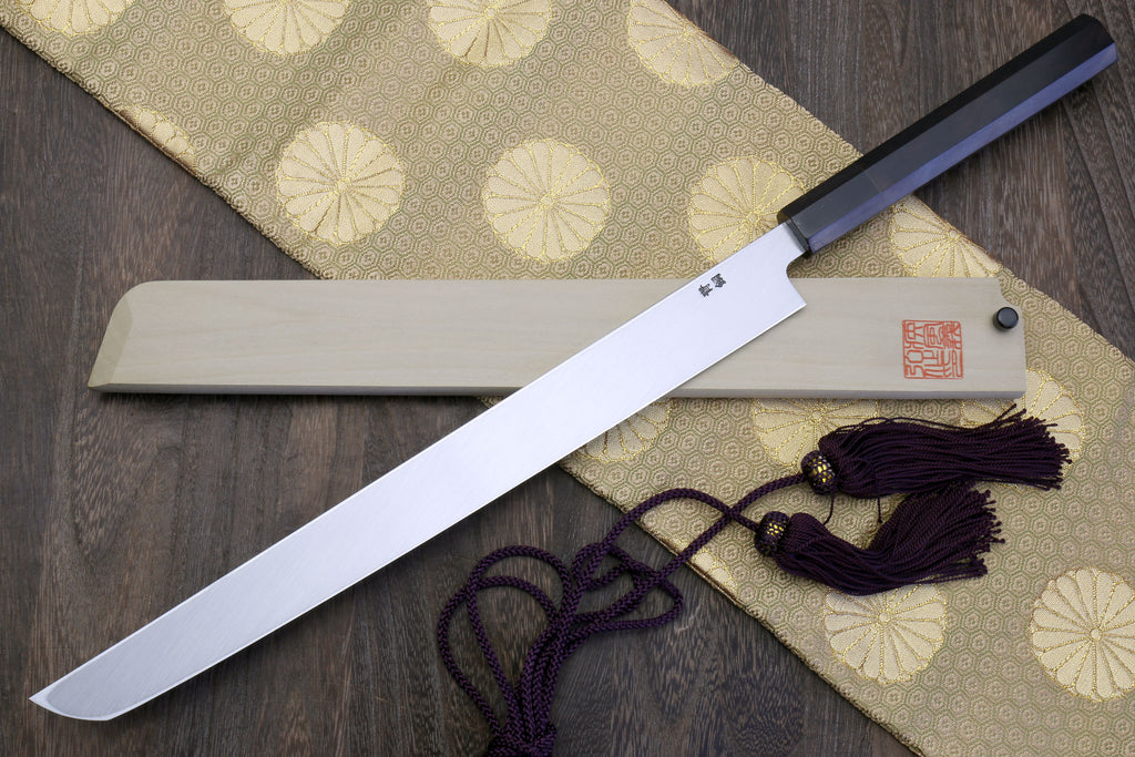Sakimaru sushi knife with white steel blade and ebony handle, shown laid out