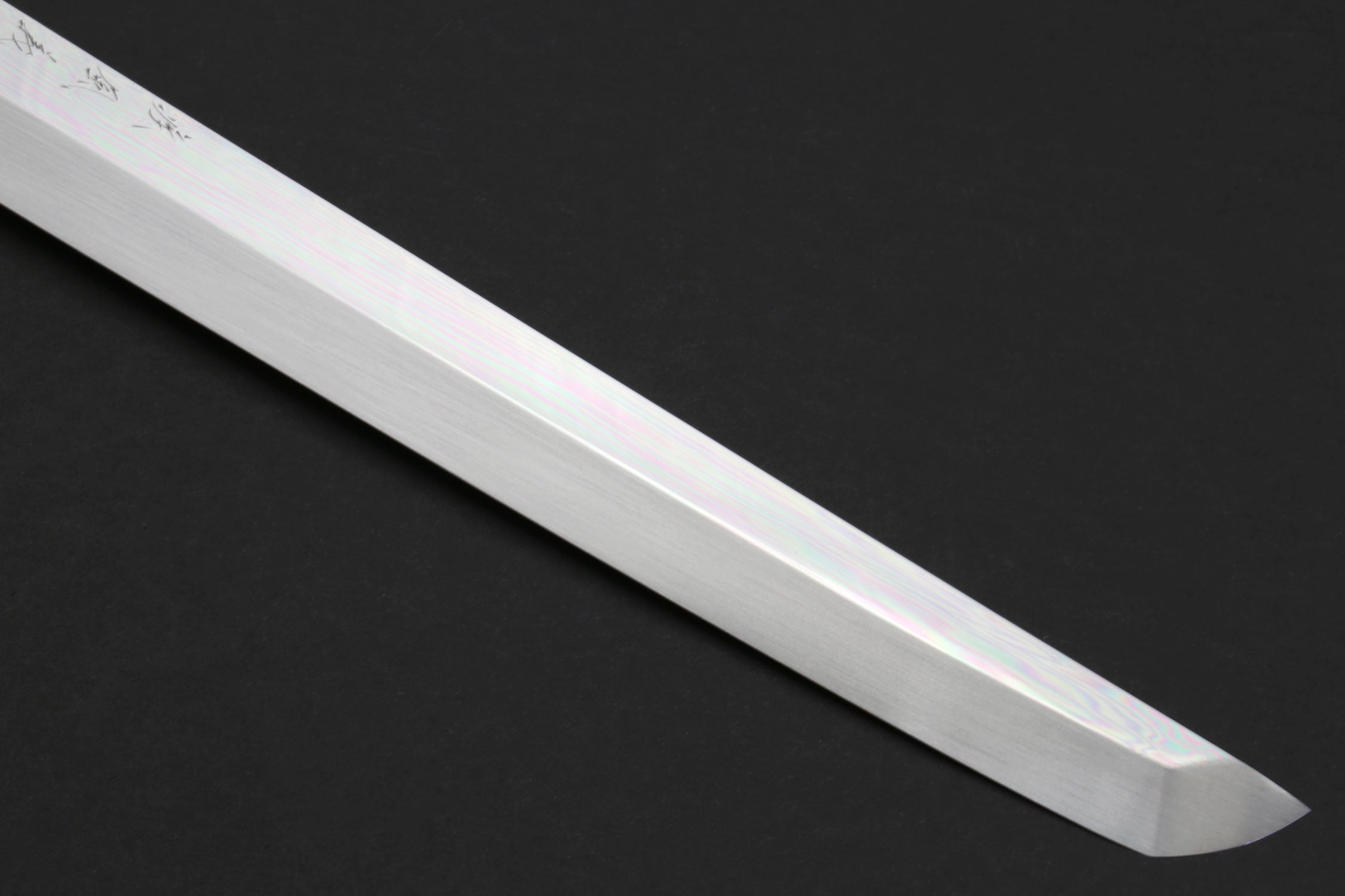 Close-up of Sakimaru sushi knife blade tip and mirror finish