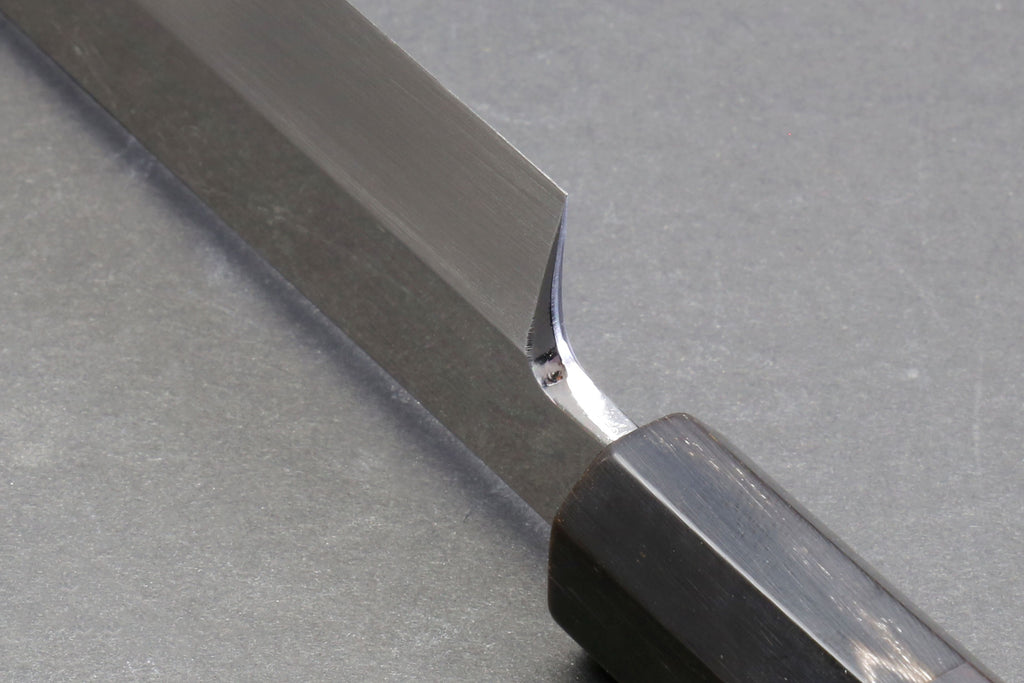 Sakimaru sushi knife edge detail with dark handle