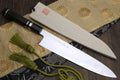 Gyuto Japanese chef knife with mirror-polished blade and ebony handle with striped accents