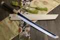 Japanese katana sword, mirror-finished silver blade, ebony handle, green cord wrap.