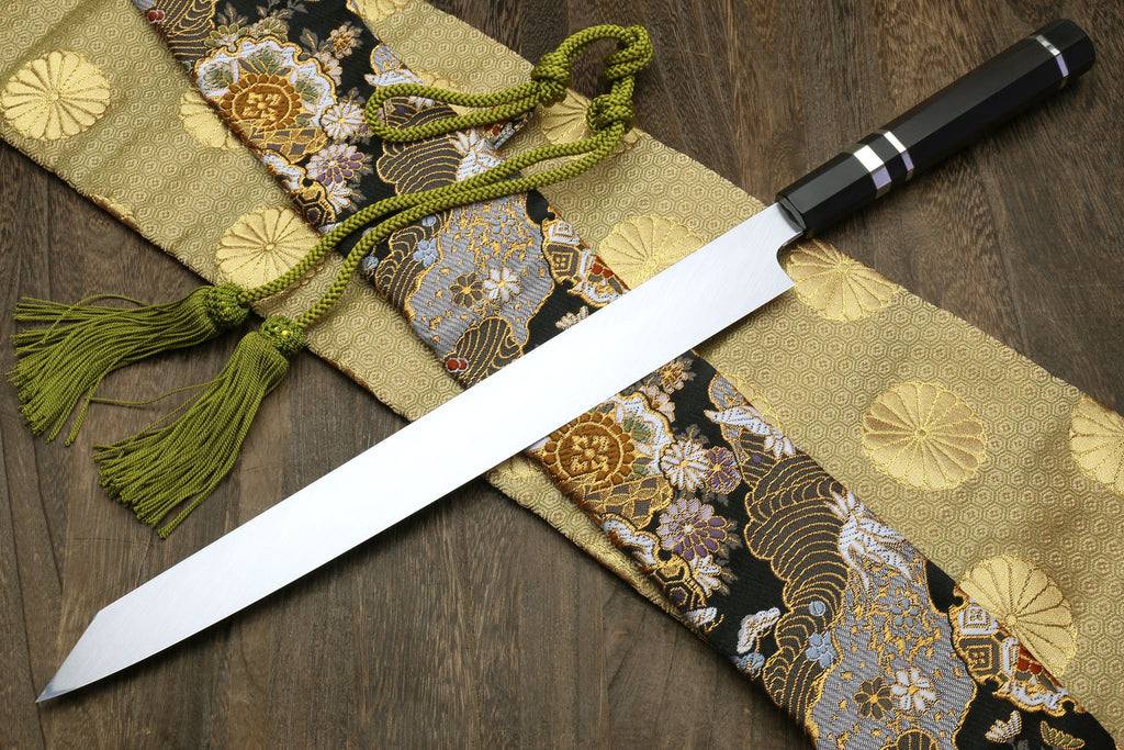 Yanagi kiritsuke knife with ebony handle, mirror blade, and silver ring