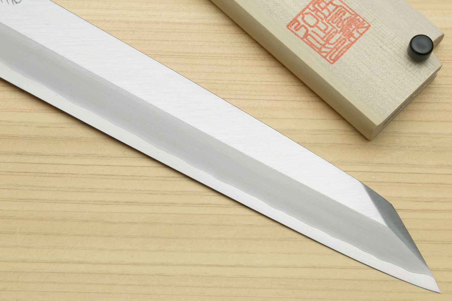 Long pointed sushi knife with silver blade edge and dark rosewood handle