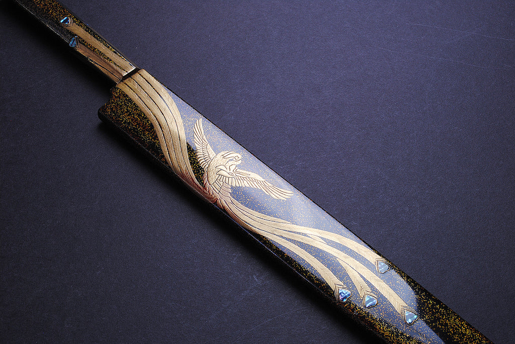 Yanagi kiritsuke knife handle with gold wavy details and phoenix-style engraving on blade