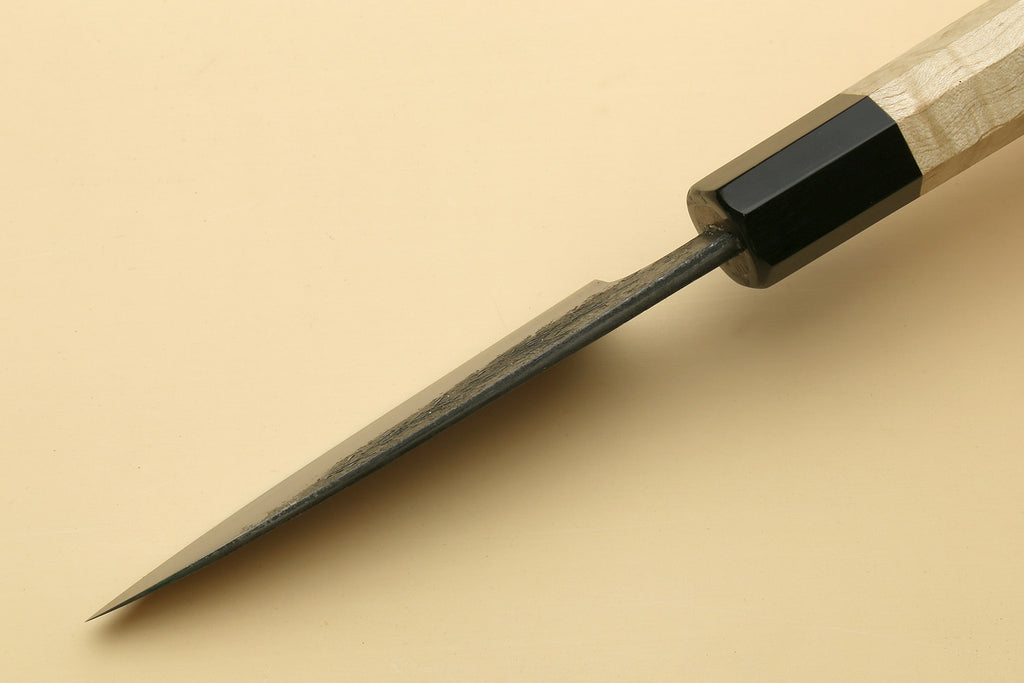 Japanese paring knife tip with speckled white-steel blade and black bolster