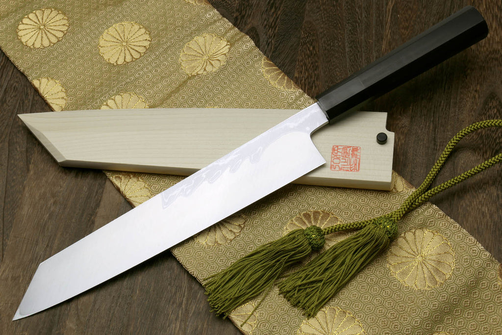 Multipurpose Japanese chef knife with white blade, dark ebony handle, green cord