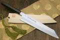 Japanese chef knife with ebony wood handle, white blade with subtle etching