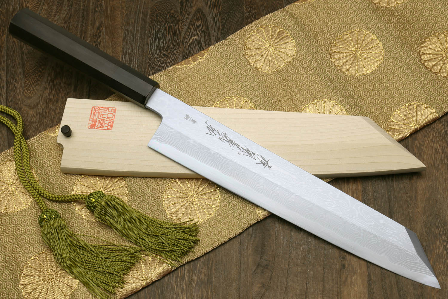 Japanese chef knife with ebony wood handle, white blade with subtle etching