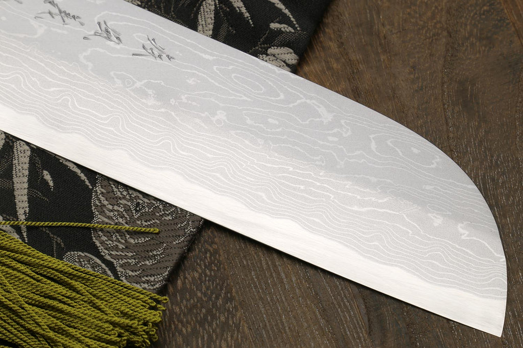 White damascus-style knife blade with wave pattern and curved tip