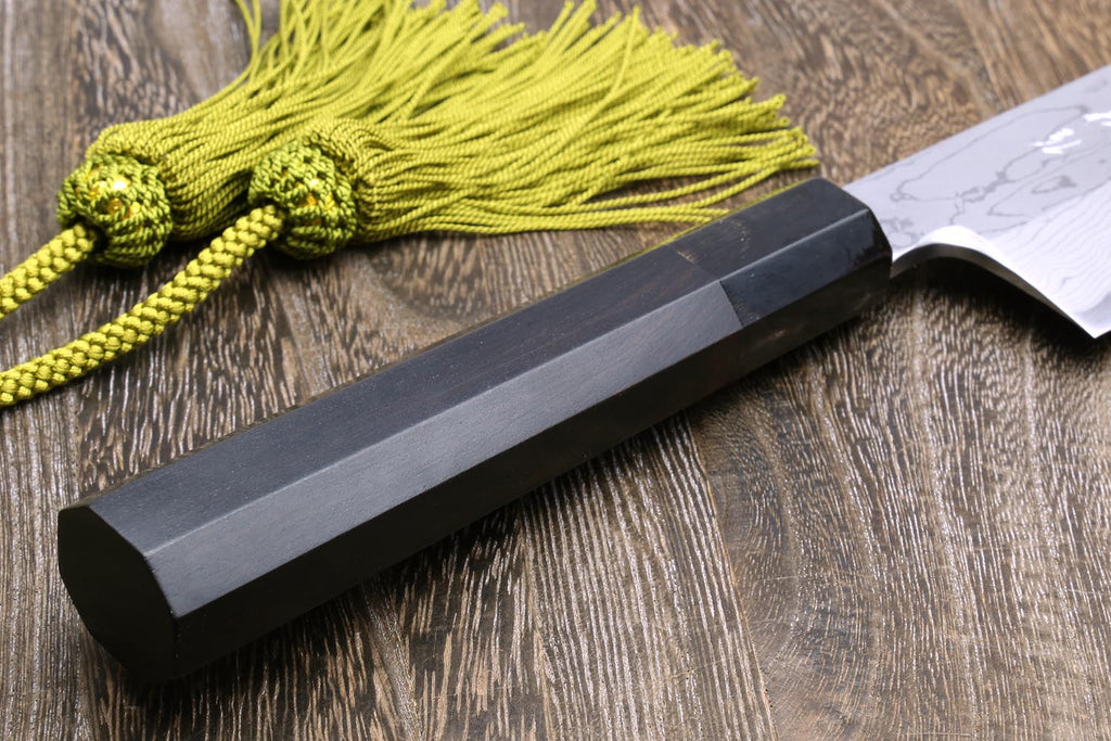 Knife handle and spine detail with green cord; white damascus blade