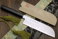 Traditional Japanese vegetable chopping knife with damascus-style blade, ebony handle