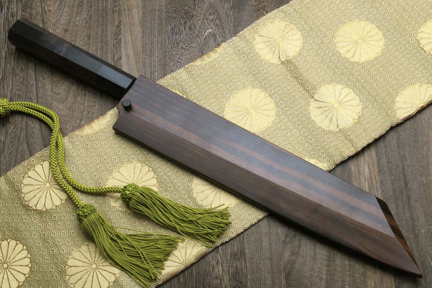 Kiritsuke chef knife in dark wood saya with ebony handle and green tassel cord
