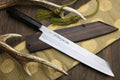 Kiritsuke Japanese chef knife with damascus blade, ebony handle, and green cord tassel