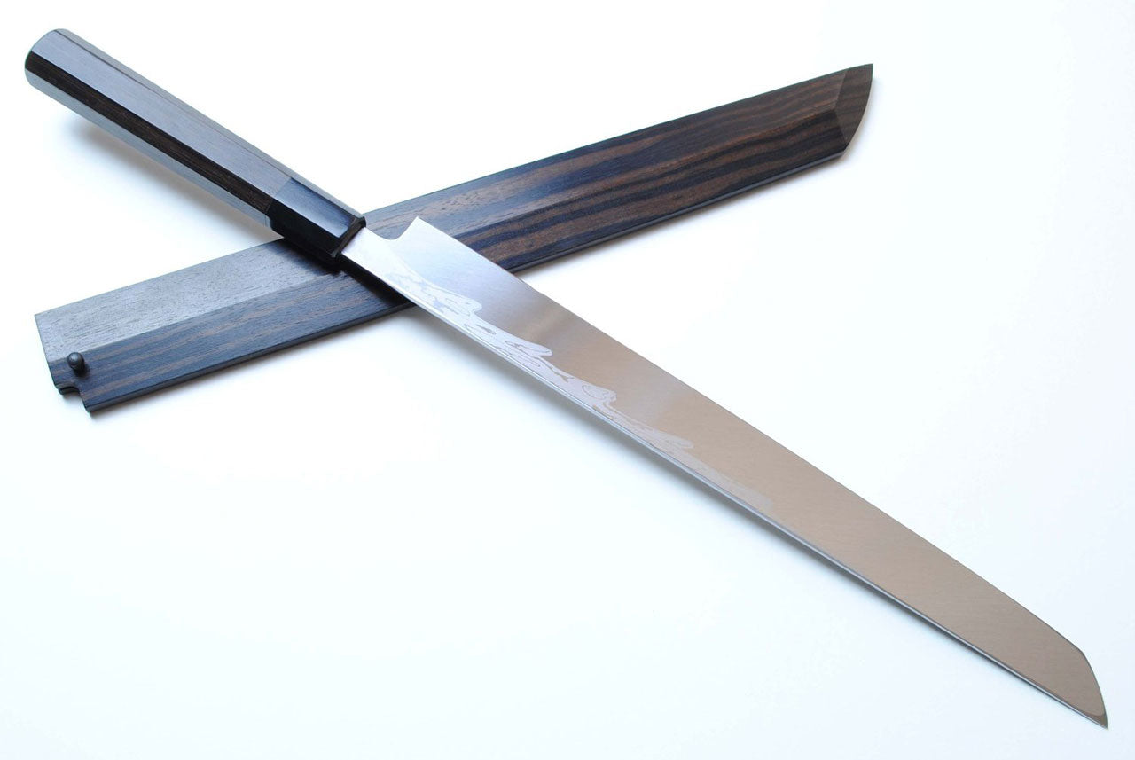 Japanese chef knife with Damascus blade, dark ebony wood handle, angled side view