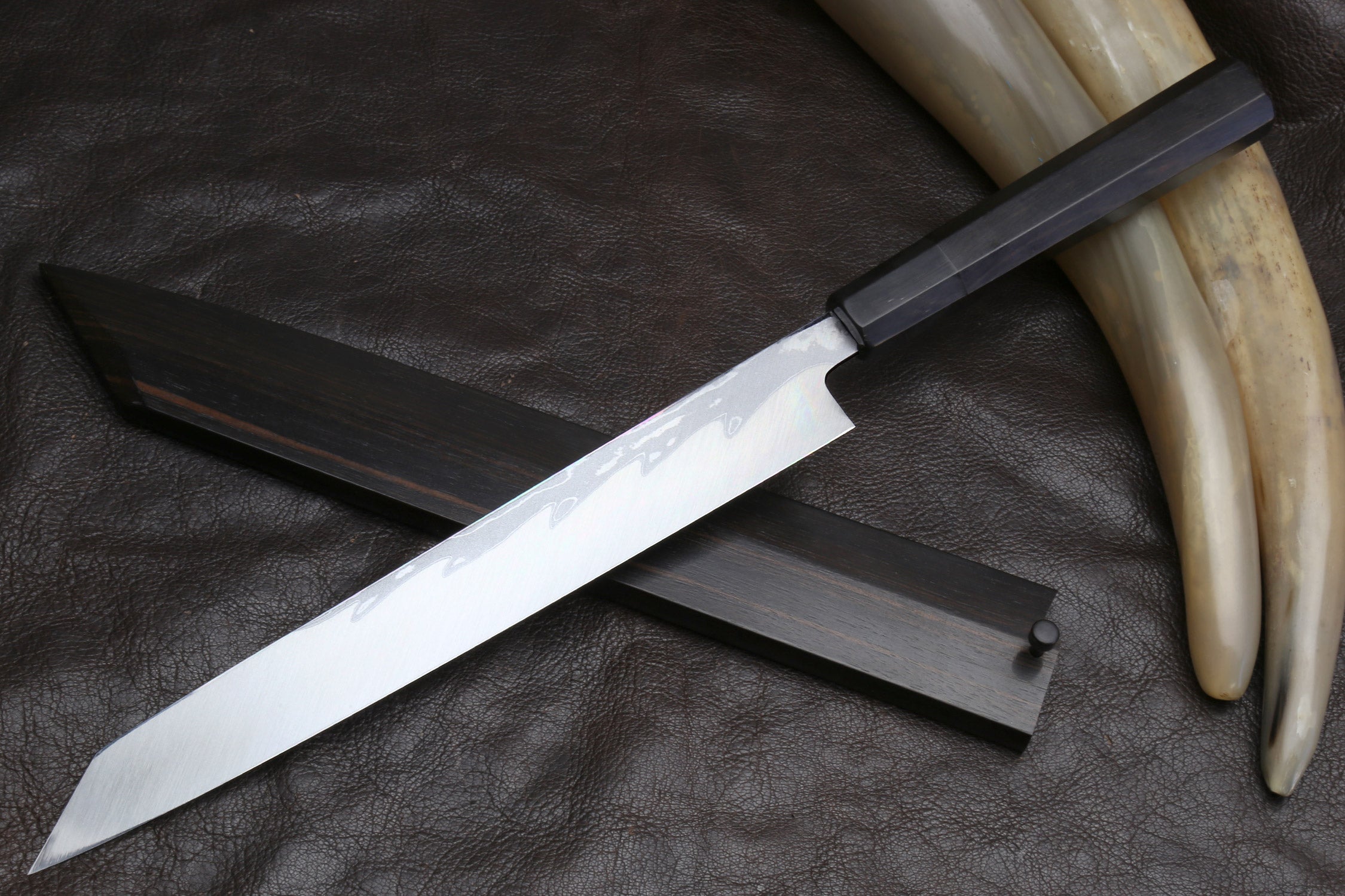 Japanese yanagi sushi knife with ivory horn handle accents and black saya