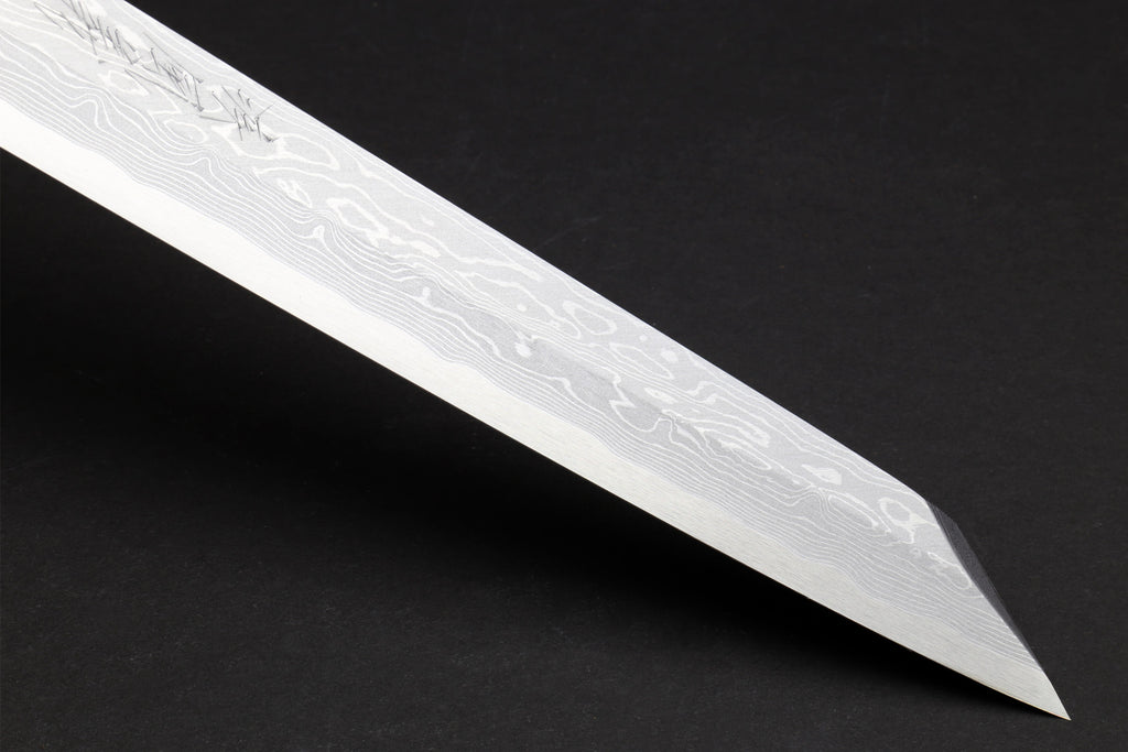 Japanese yanagi sushi knife close-up of pointed damascus blade