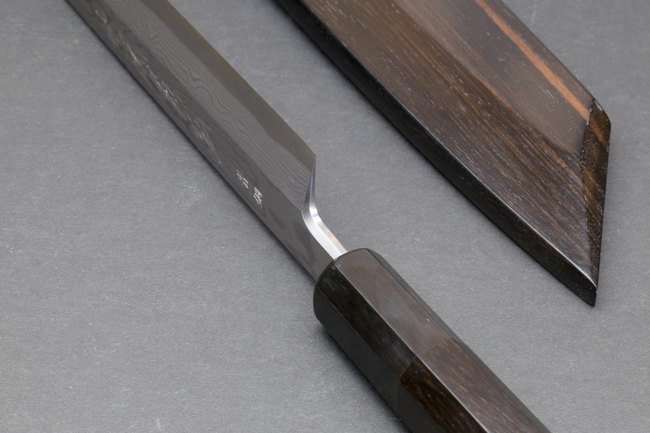 Japanese yanagi sushi knife with damascus-pattern blade and ebony handle