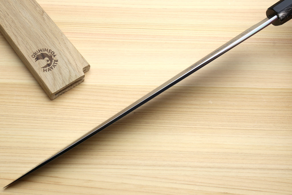 Yanagi sushi knife showing ebony handle and long tapered blade tip