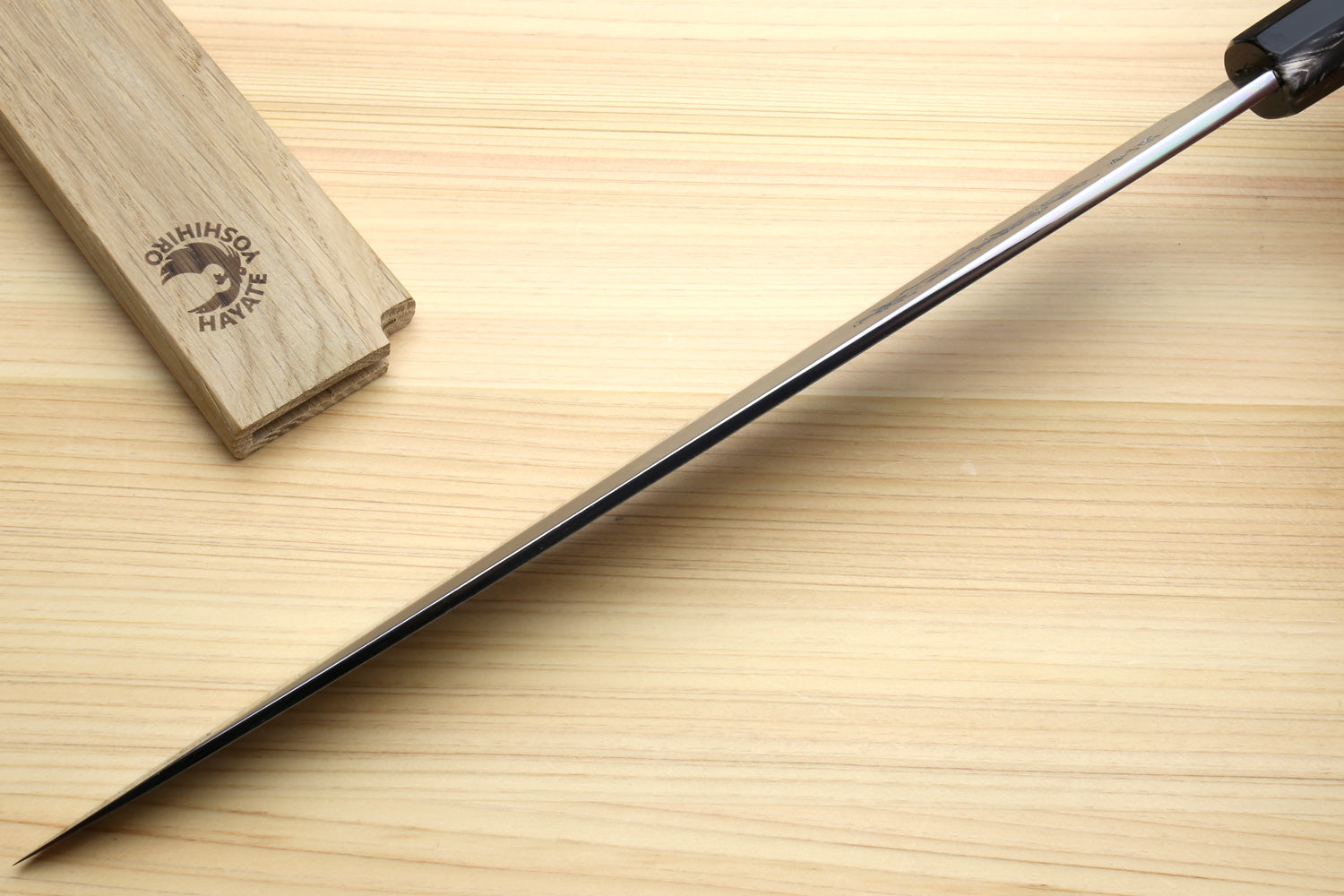Yanagi sushi knife showing ebony handle and long tapered blade tip