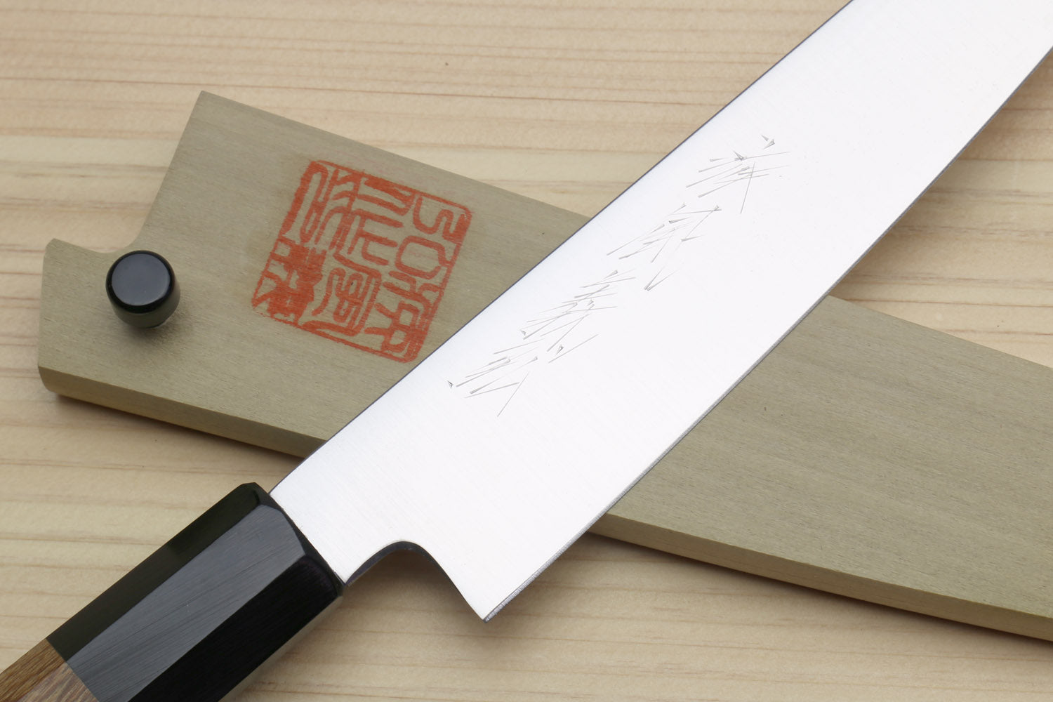 Petty utility knife with stainless blade and saya cover, red logo on beige cover