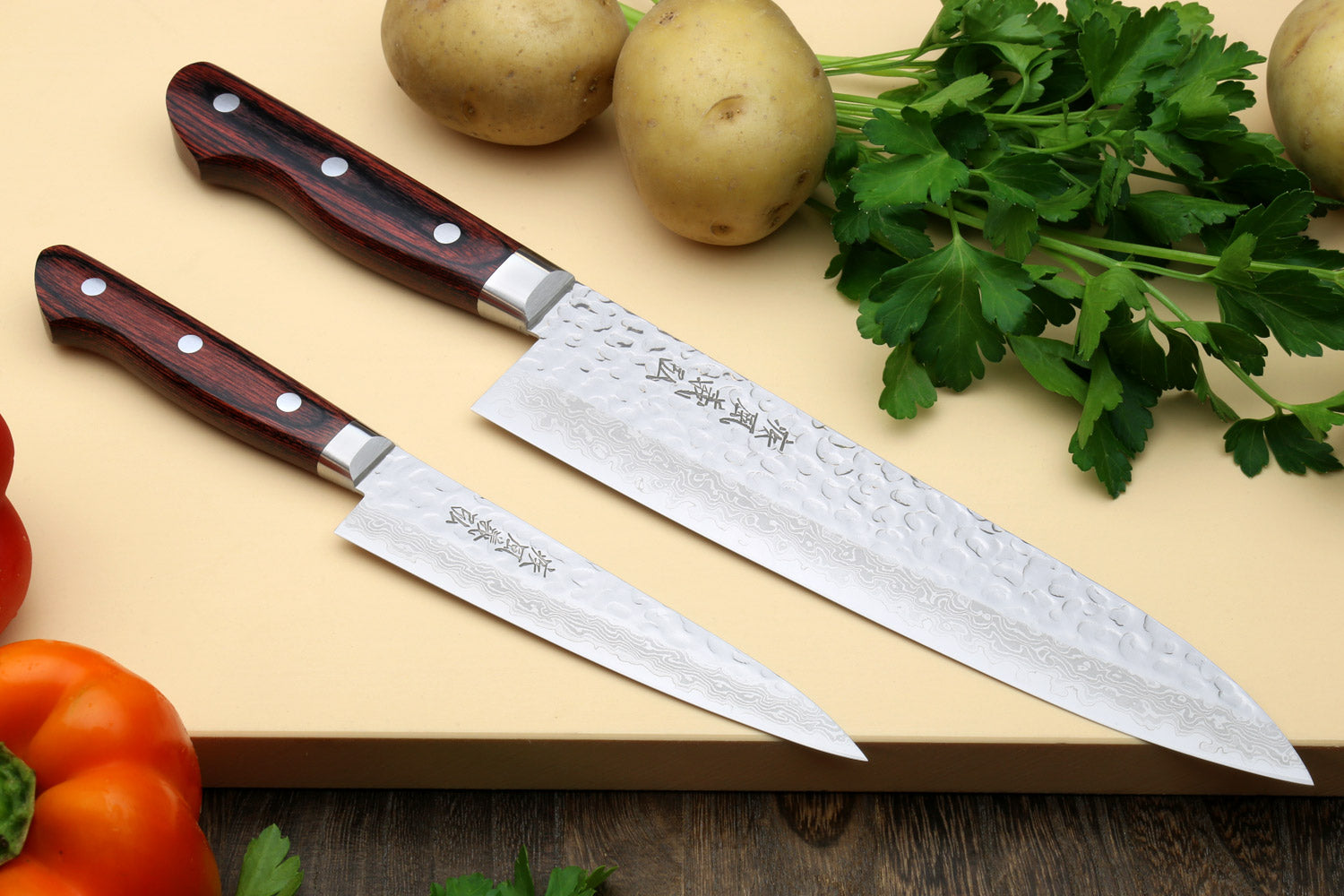 Damascus stainless gyuto and petty knives with dark red wood handles