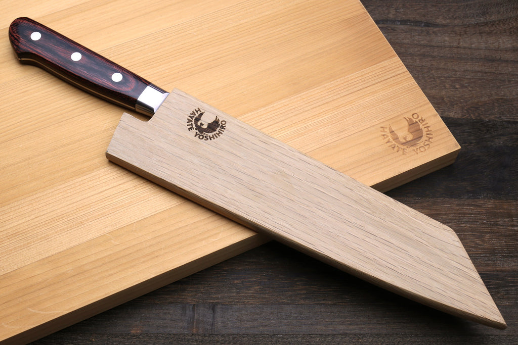 Kiritsuke multipurpose knife with hammered Damascus blade and dark wood handle