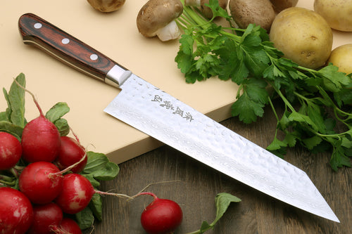 Kiritsuke knife with hammered Damascus blade, dark handle, and metal bolster