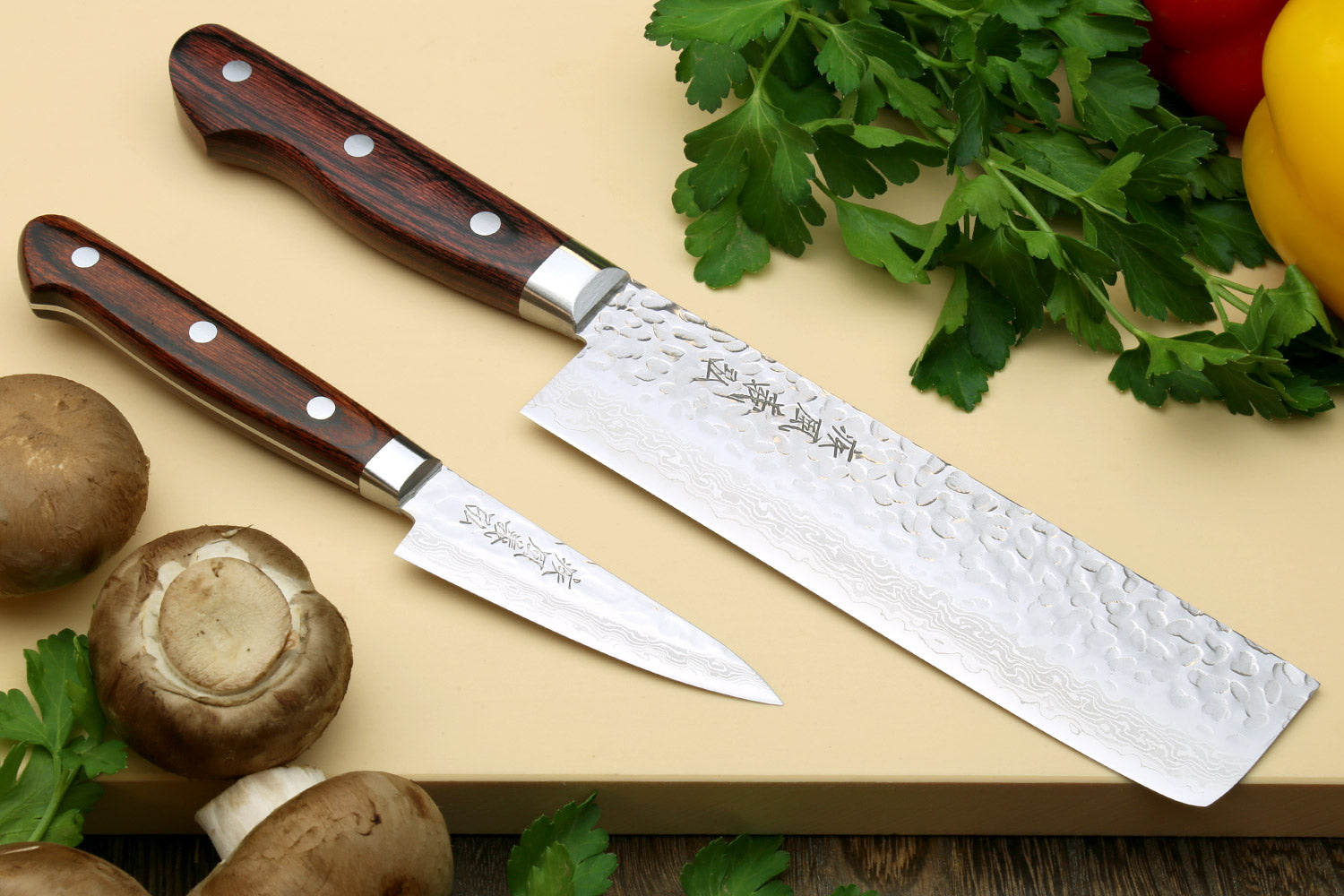 Damascus stainless steel knife set with hammered pattern, dark wood handles