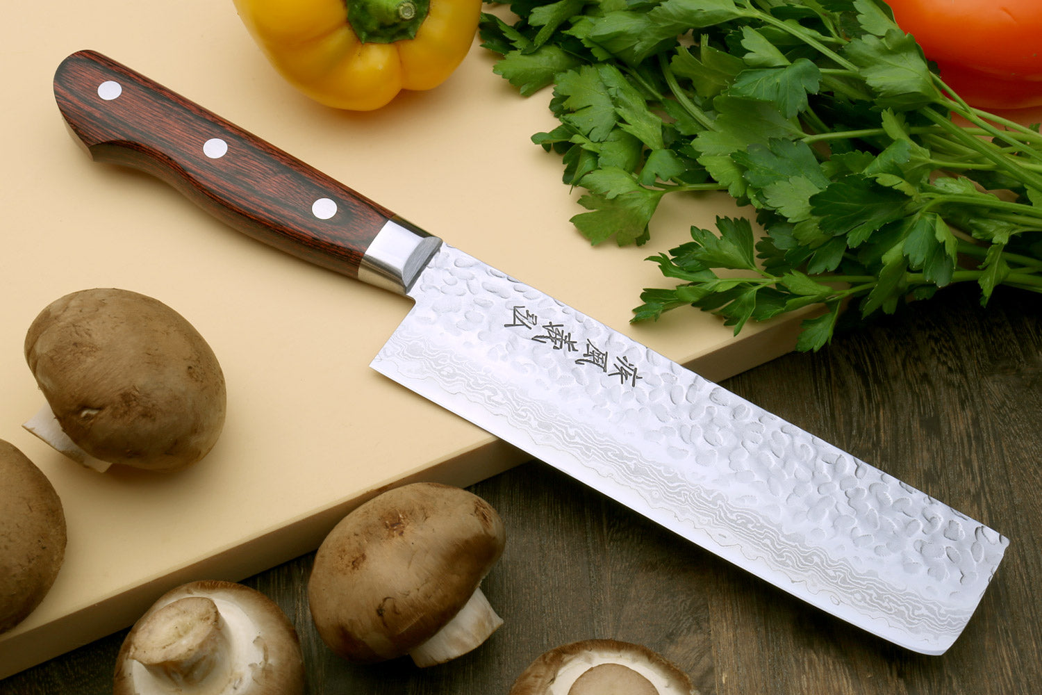 Damascus stainless steel nakiri and paring knives, hammered pattern, dark wood handles
