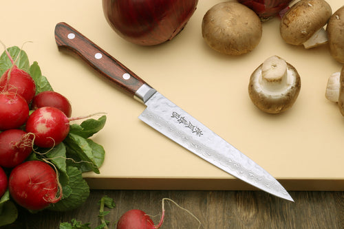 Petty knife with hammered damascus blade and dark red-brown wood handle