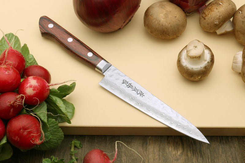 Petty knife with hammered damascus blade and dark red-brown wood handle