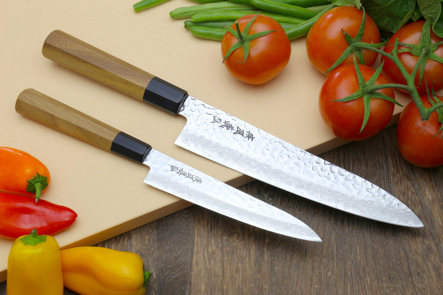 Damascus gyuto and petty knives with ambrosia wooden handles and black bolster
