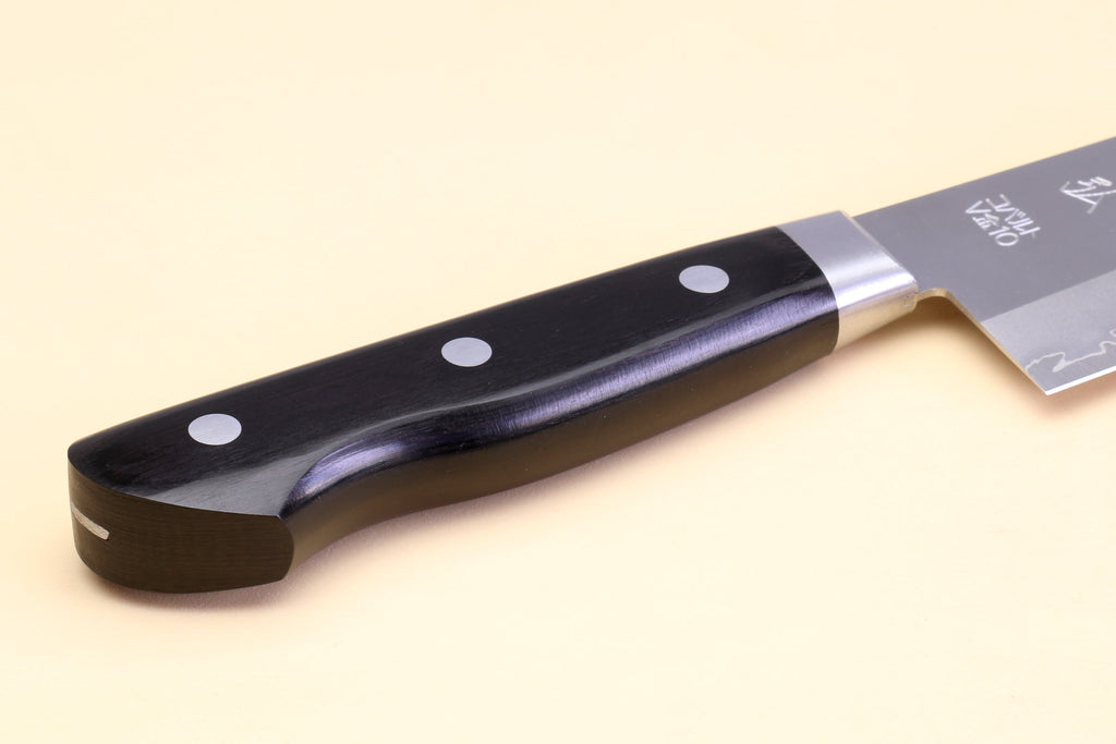 Gyuto chef knife handle close-up with black scales and three silver rivets.