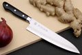 210mm gyuto chef knife with white steel blade and black riveted handle.