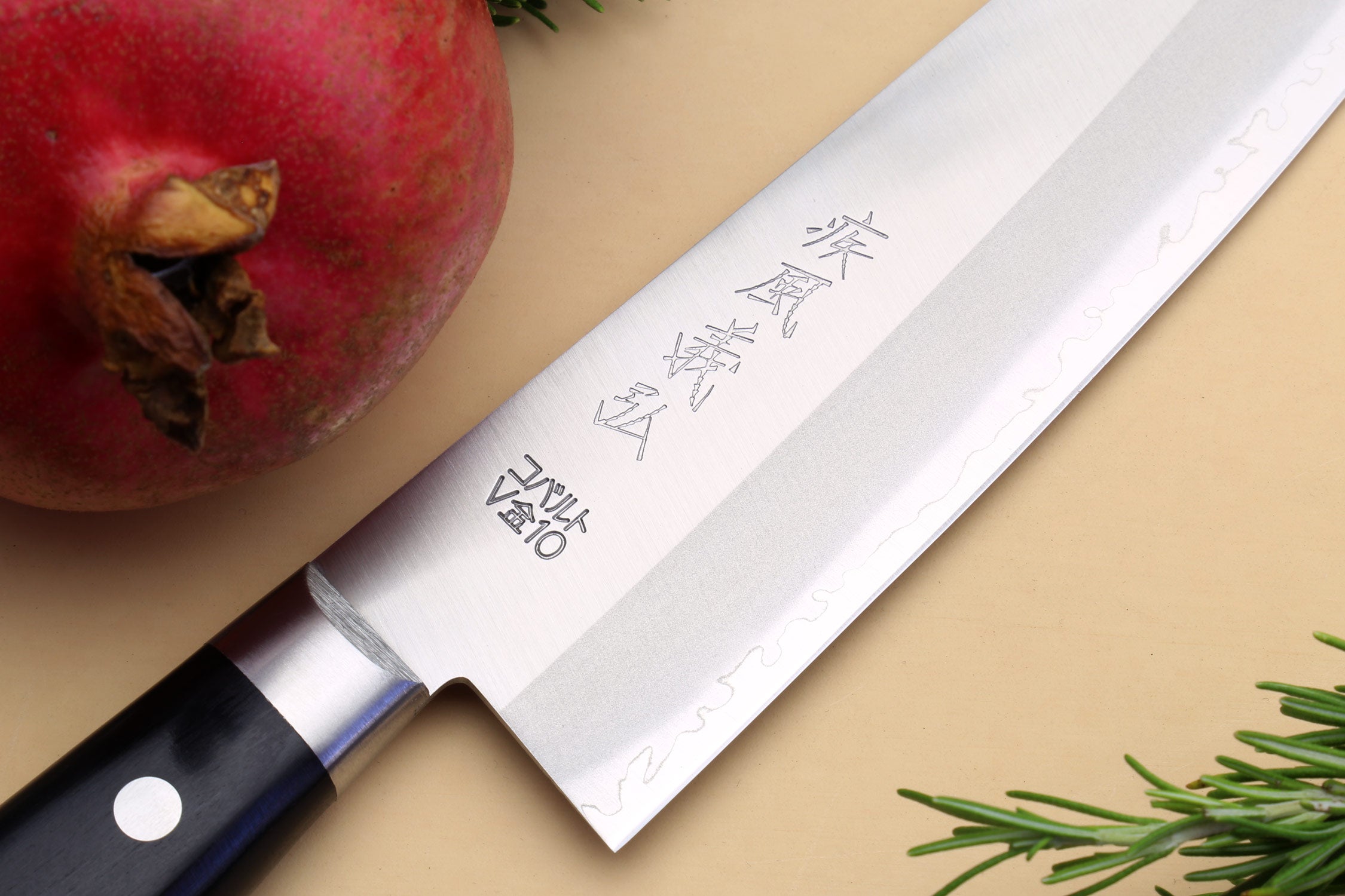 Santoku chef knife with etched silver blade and dark wood-style handle