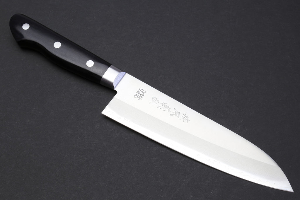 Santoku chef knife with dark handle, silver blade, and etched branding