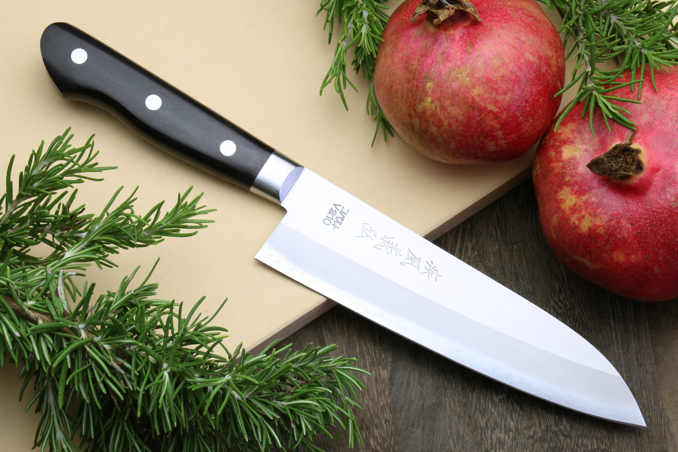 7-inch santoku chef knife with dark handle and silver stainless blade